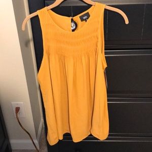 Yellow sleeveless blouse